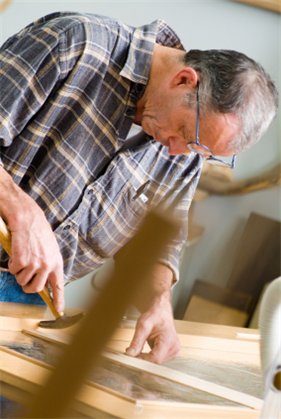 Carpenter manufacturing a sash window